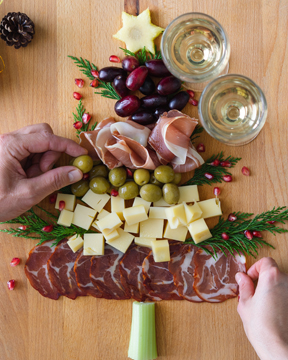 Meat, cheese and olives designed into a tree